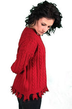 DISTRESSED CABLE KNIT SWEATER